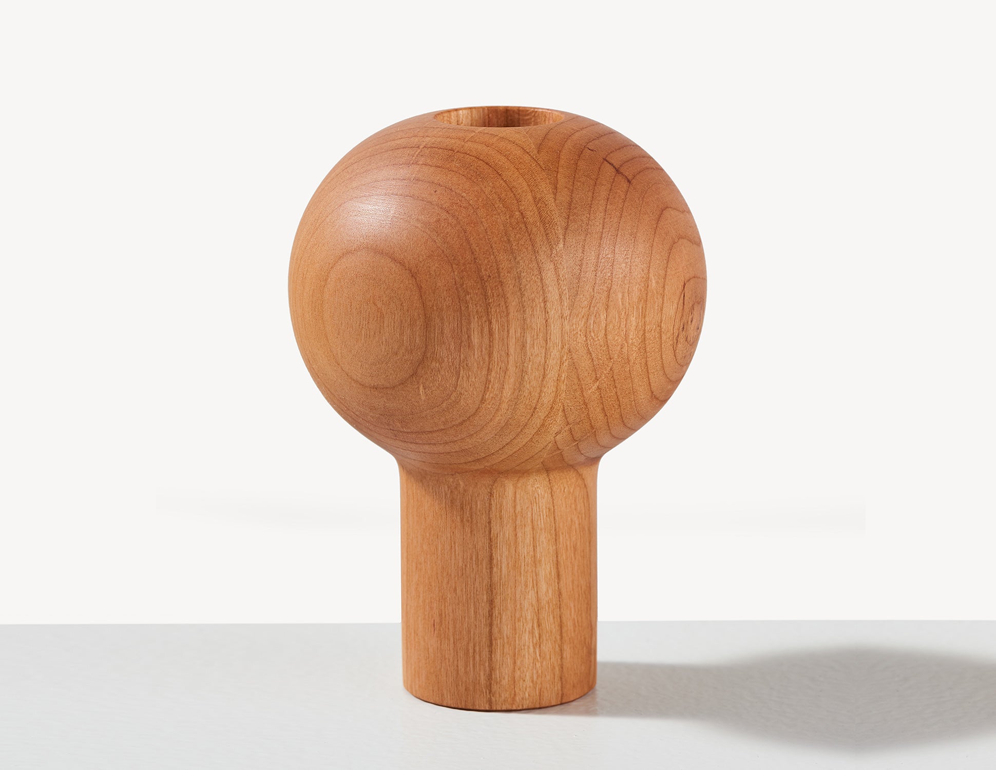 round wooden dry vase in cherry wood.