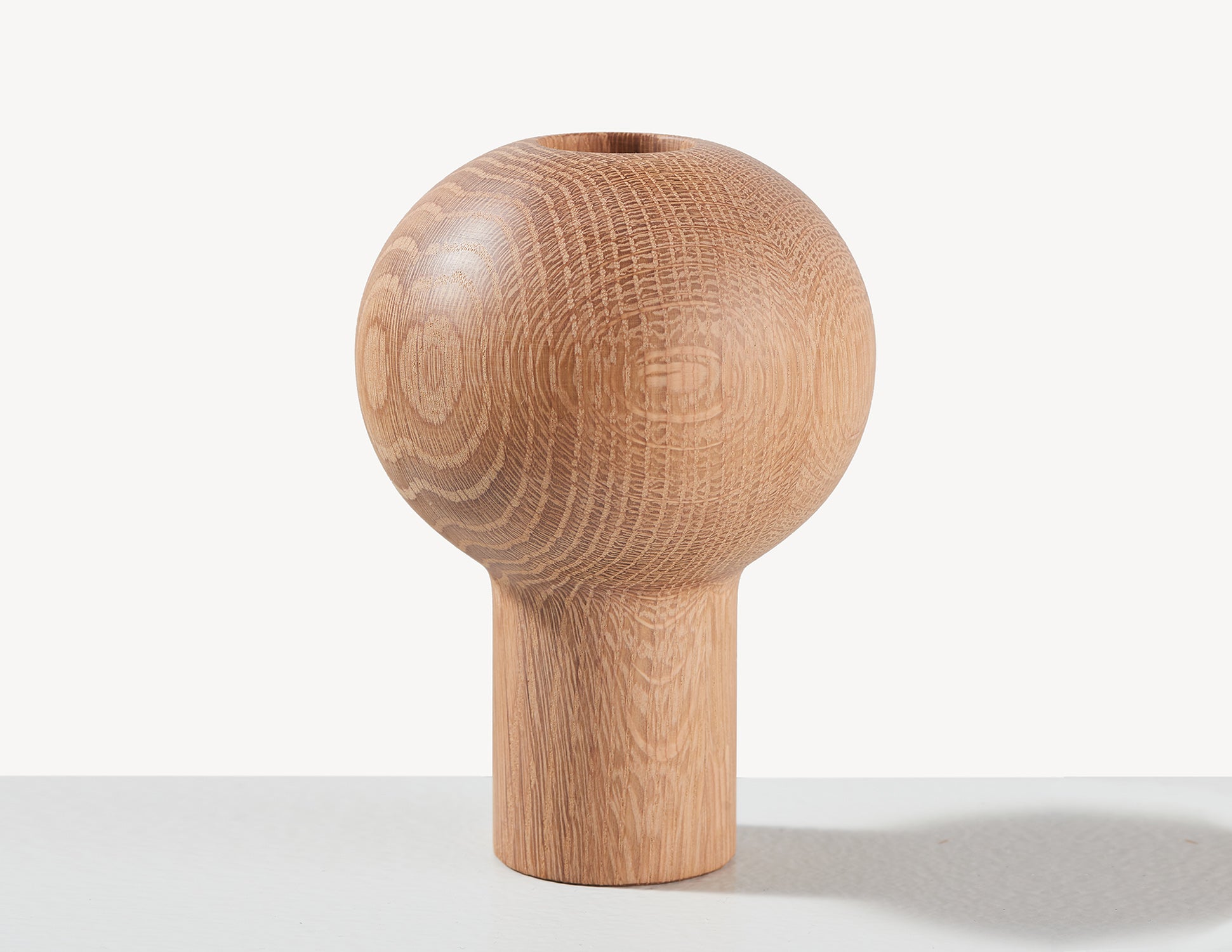 round wooden oak dry vase in light wood